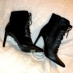Black zipper tie up booties.